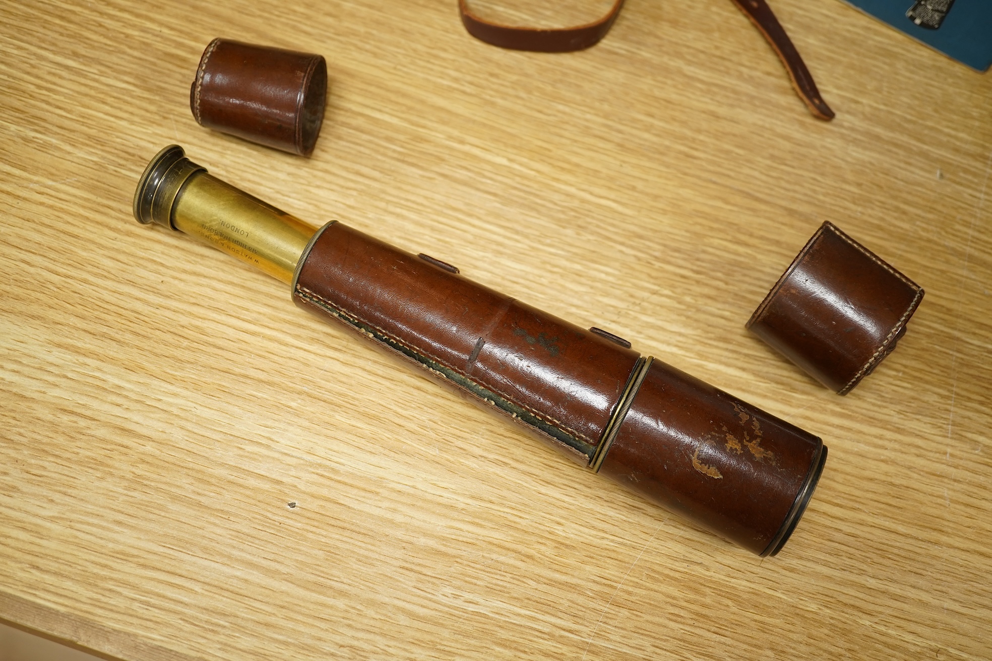 A leather cased telescope, a Zeiss Ikon camera and cased Zeiss Decarem 10 x 50 binoculars- 20cm high plus original box, 20cm high